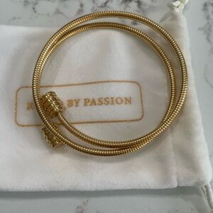 Gold twisted bangle bracelet.  Water-proof, rust resistant. Never been worn.